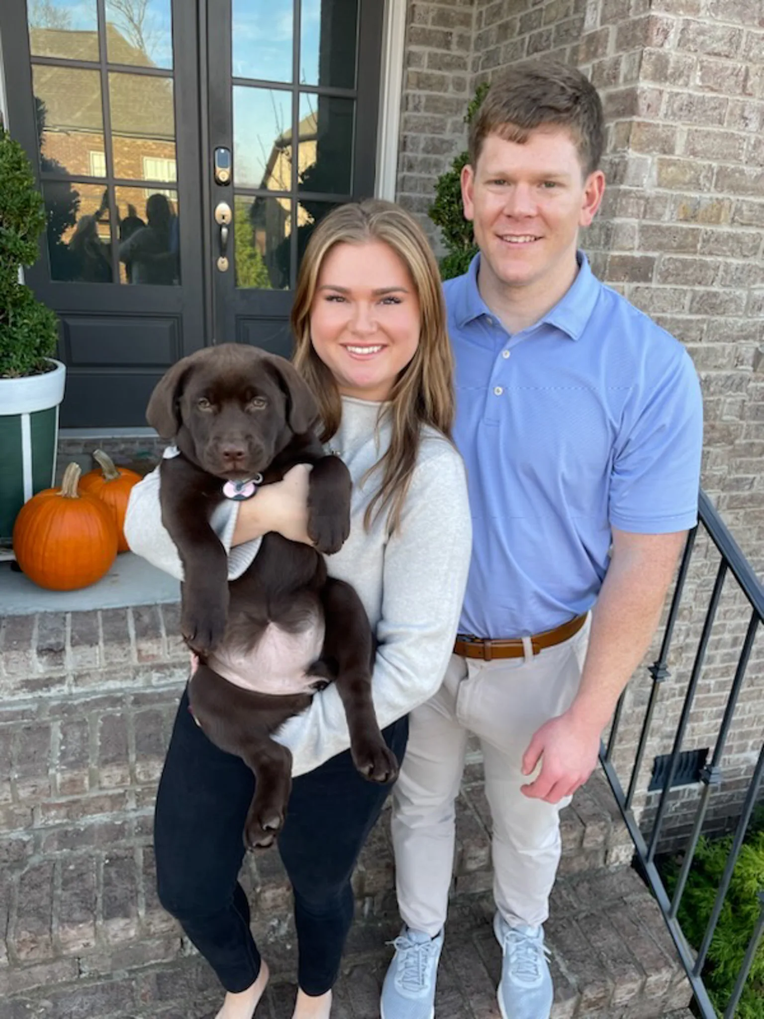 A previous Happiest Labrador puppy at home with their family